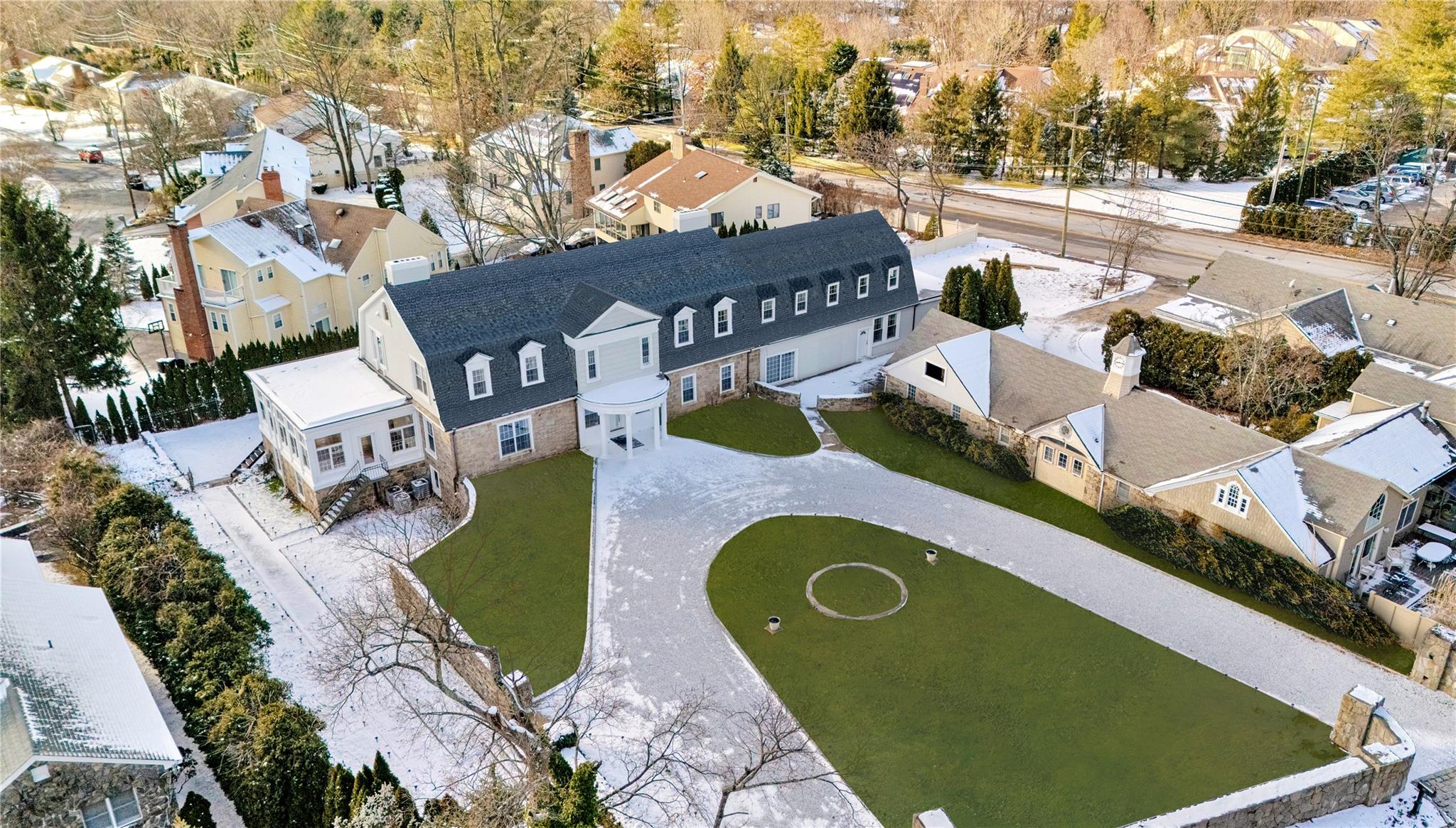 an aerial view of a house with a swimming pool