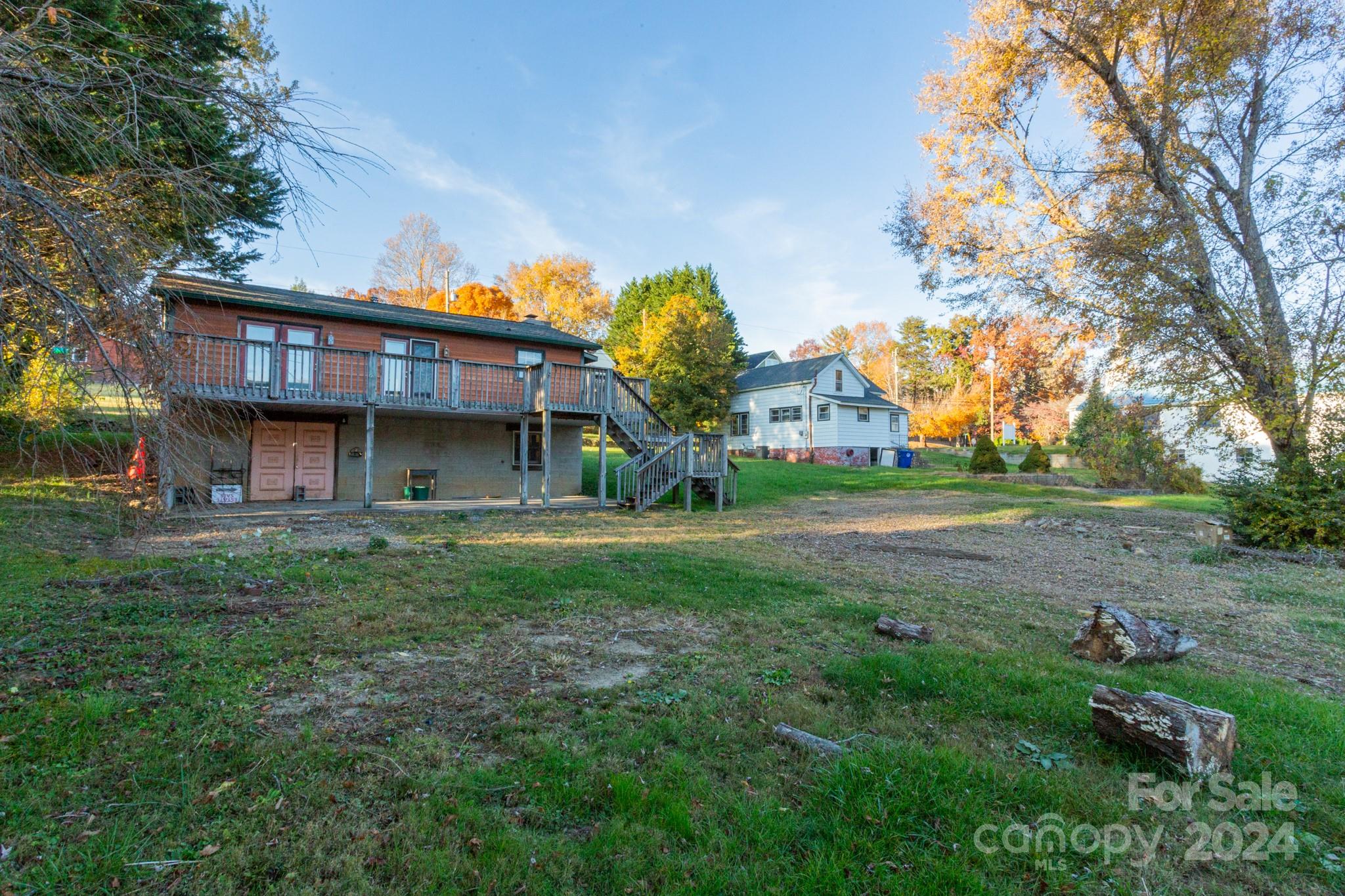 a view of house with yard