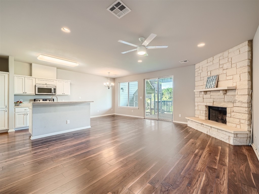 a view of kitchen with granite countertop cabinets and wooden floor