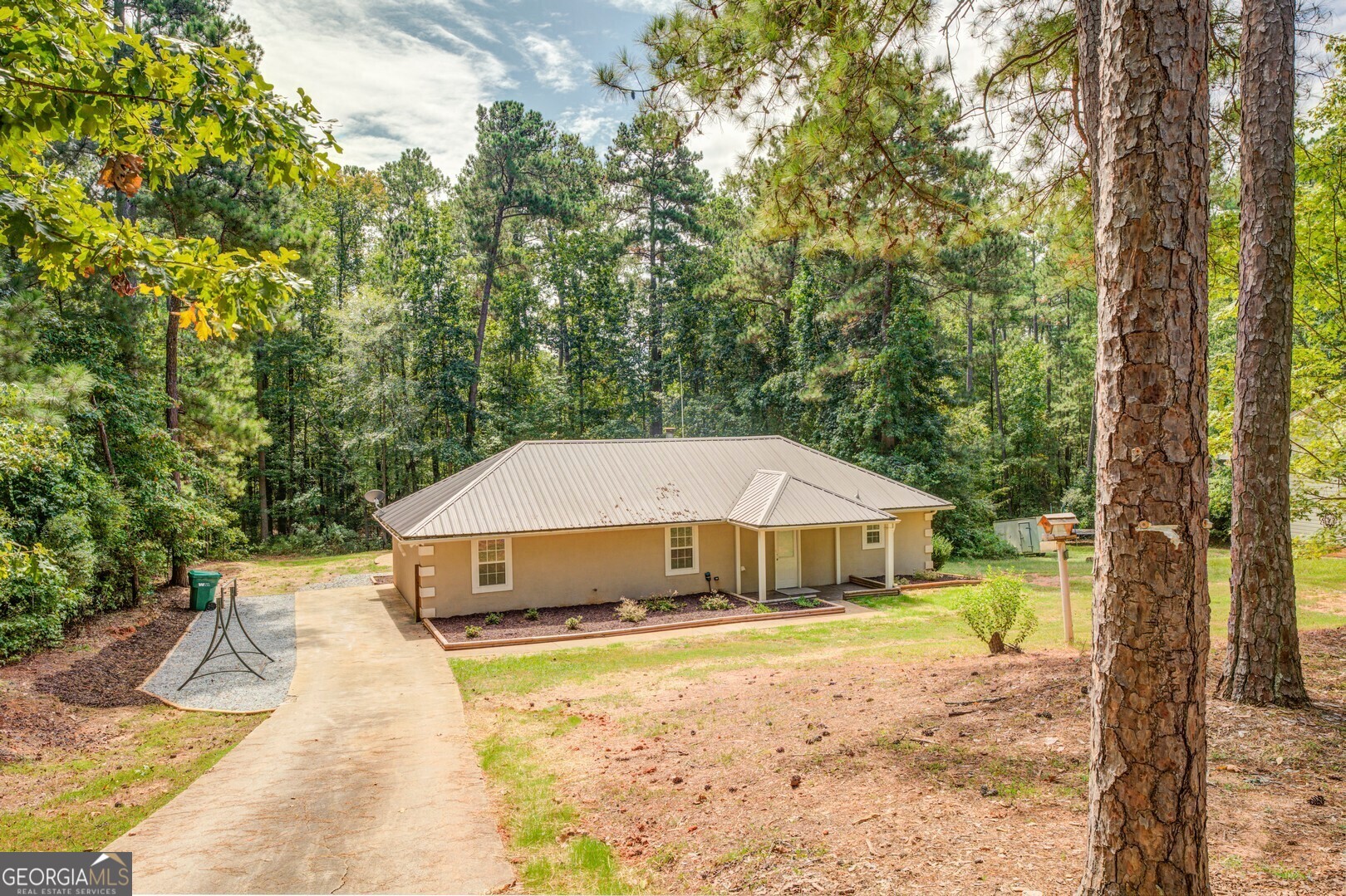 a house that has a tree in the background