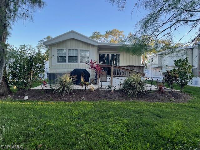 a front view of house with yard and outdoor seating