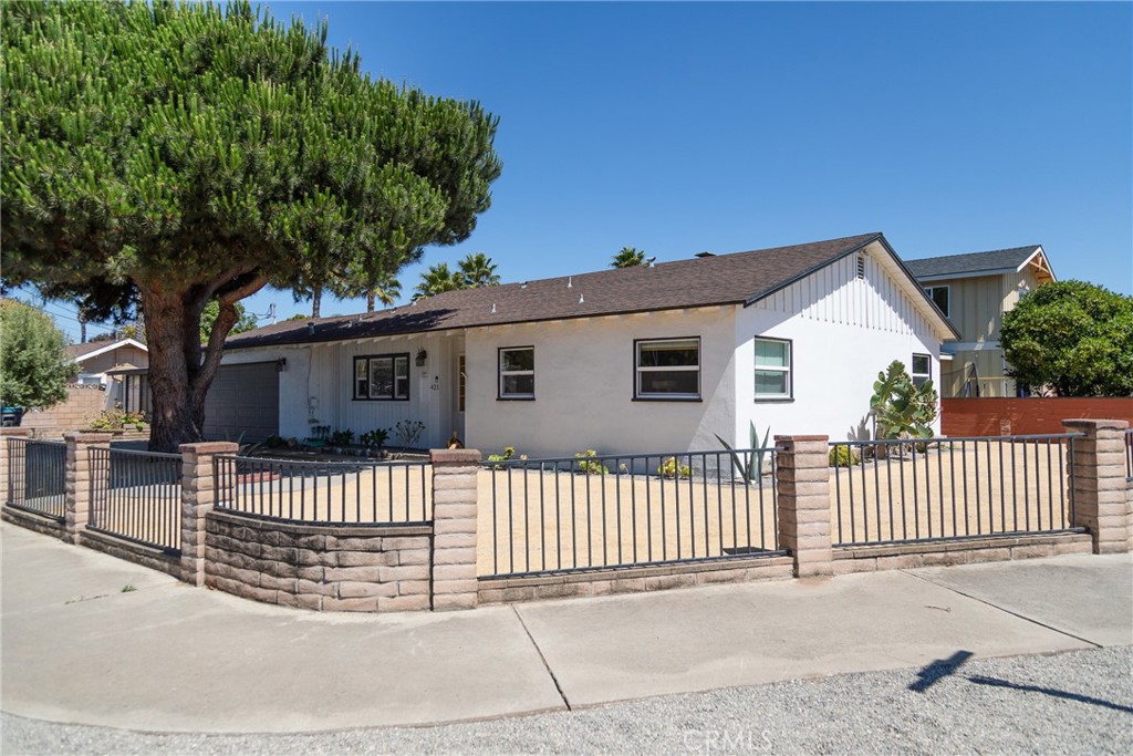 a view of a house with a fence