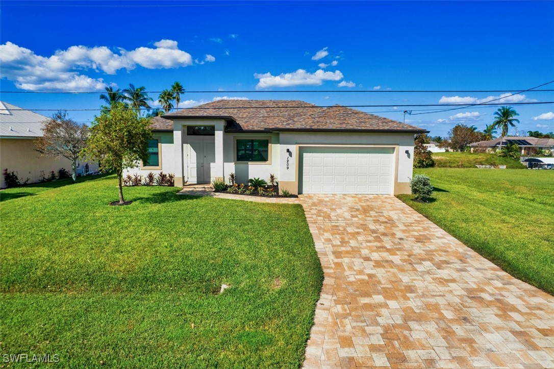 a front view of a house with a yard