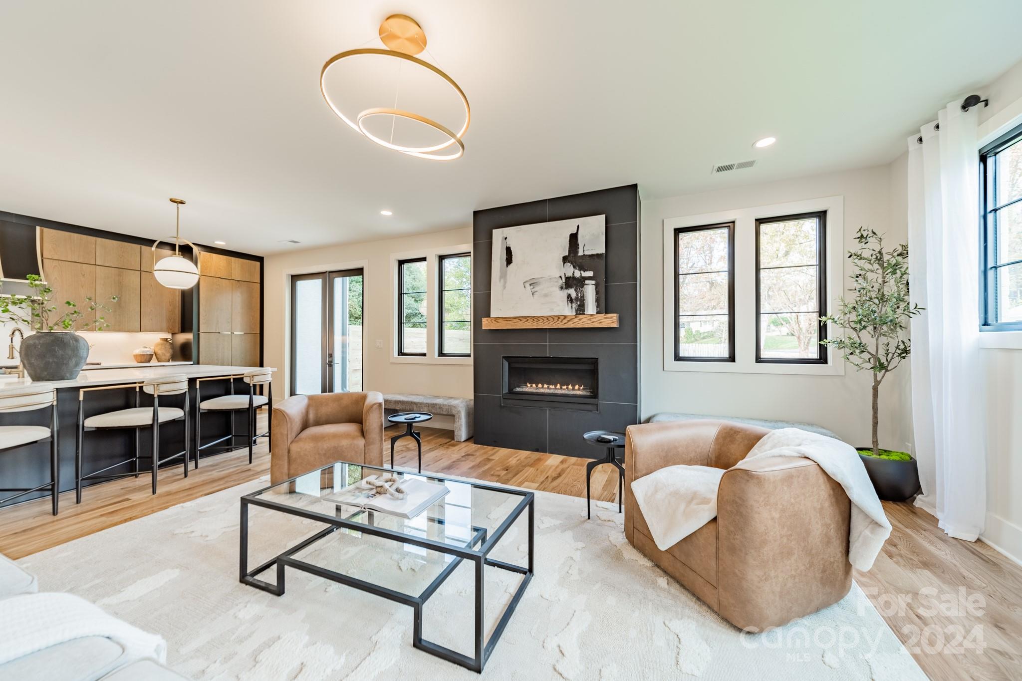 a living room with furniture fireplace and window