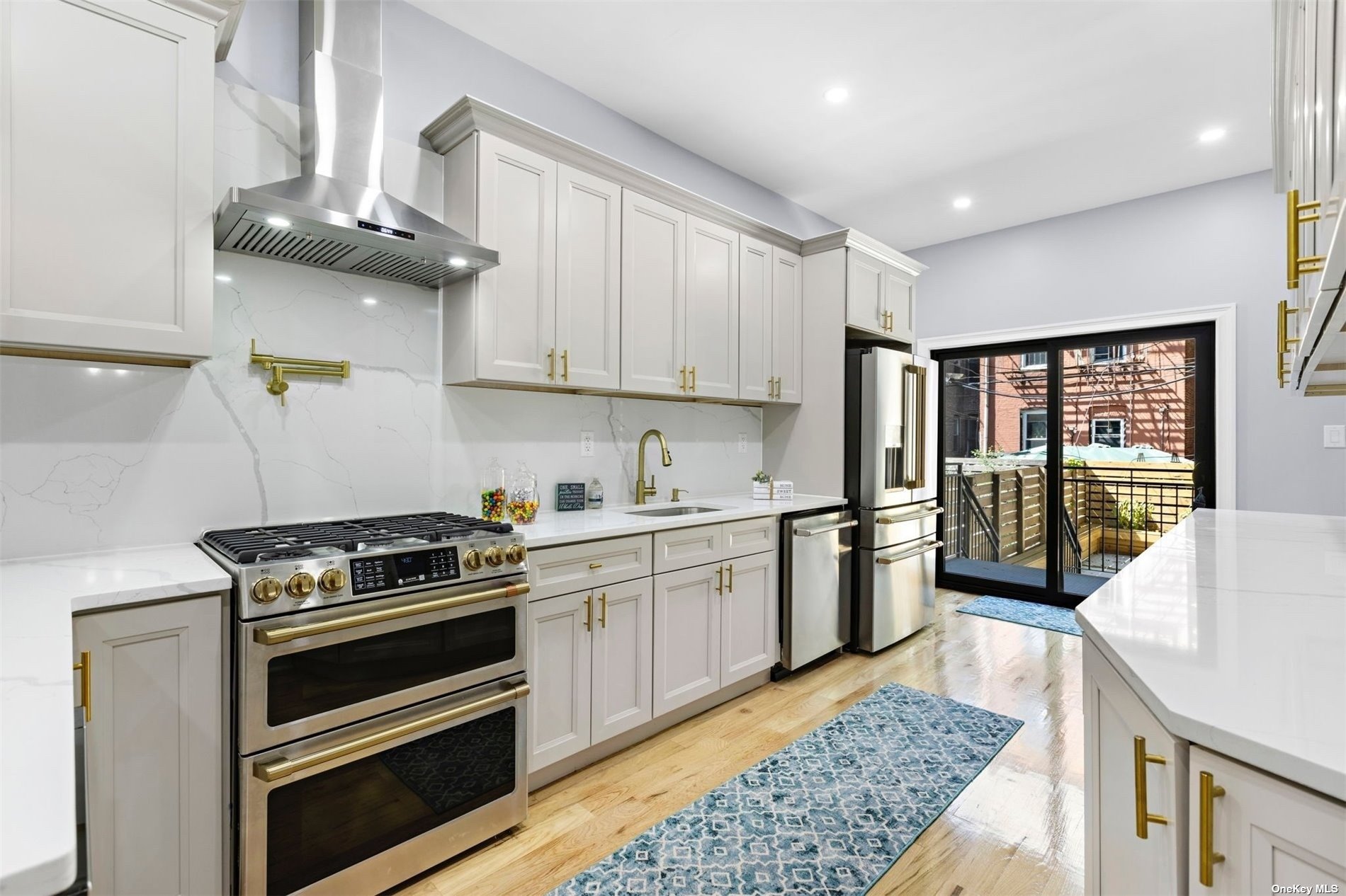 a kitchen with a stove a sink and a refrigerator