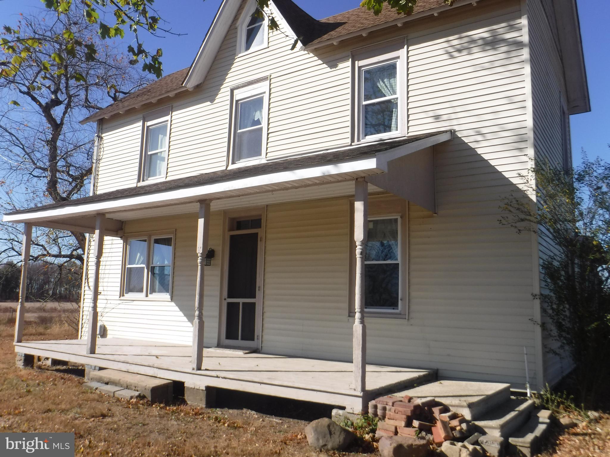 a view of a house with a door and a chair