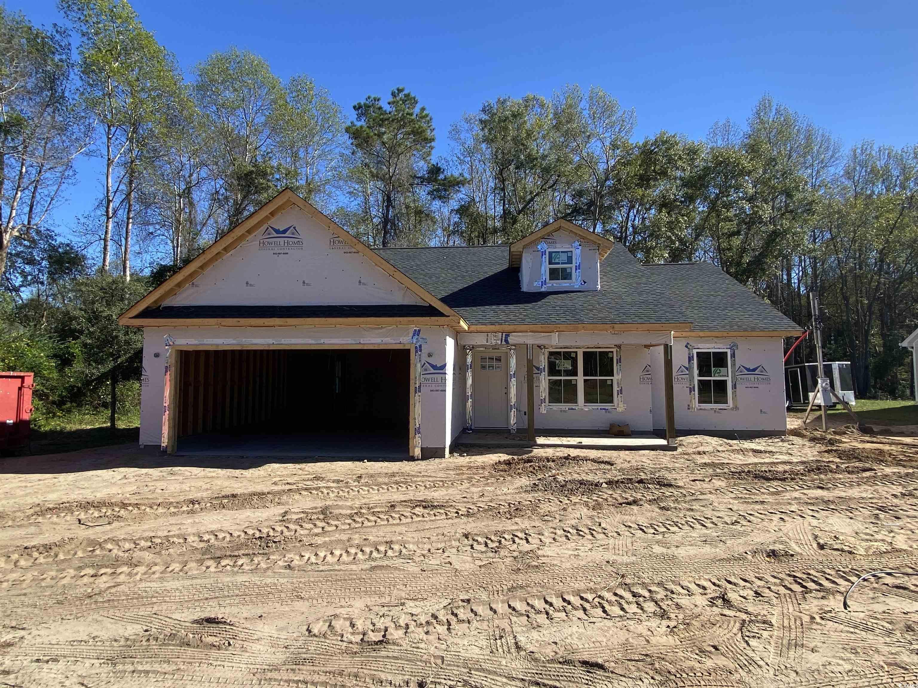 Property under construction with a garage