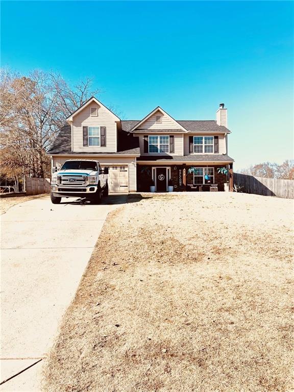 a view of front of house with a yard