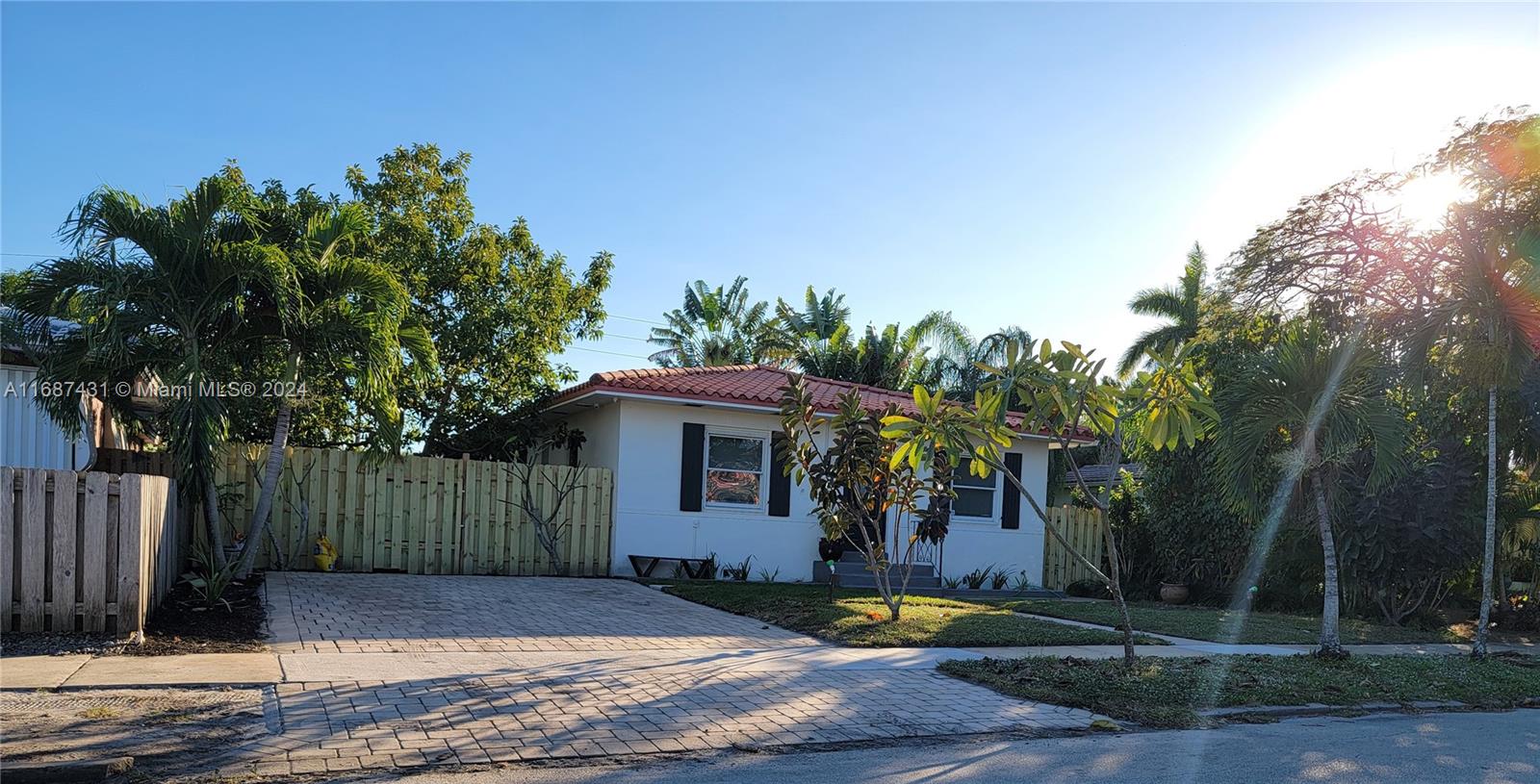 a front view of a house with trees