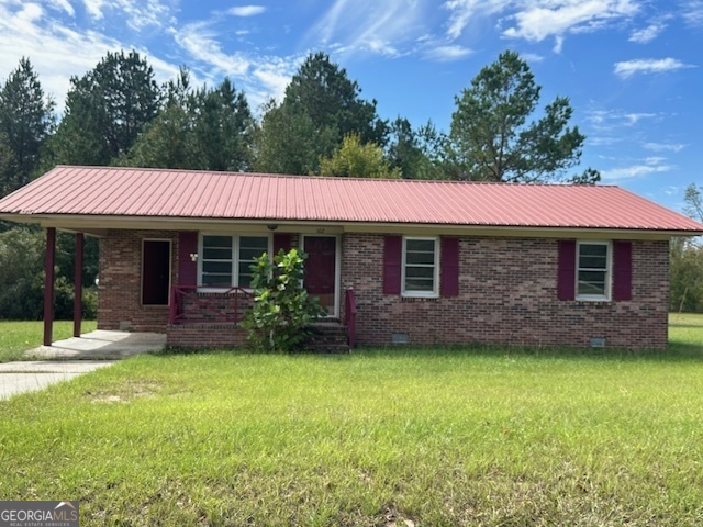 a front view of a house with a garden and porch