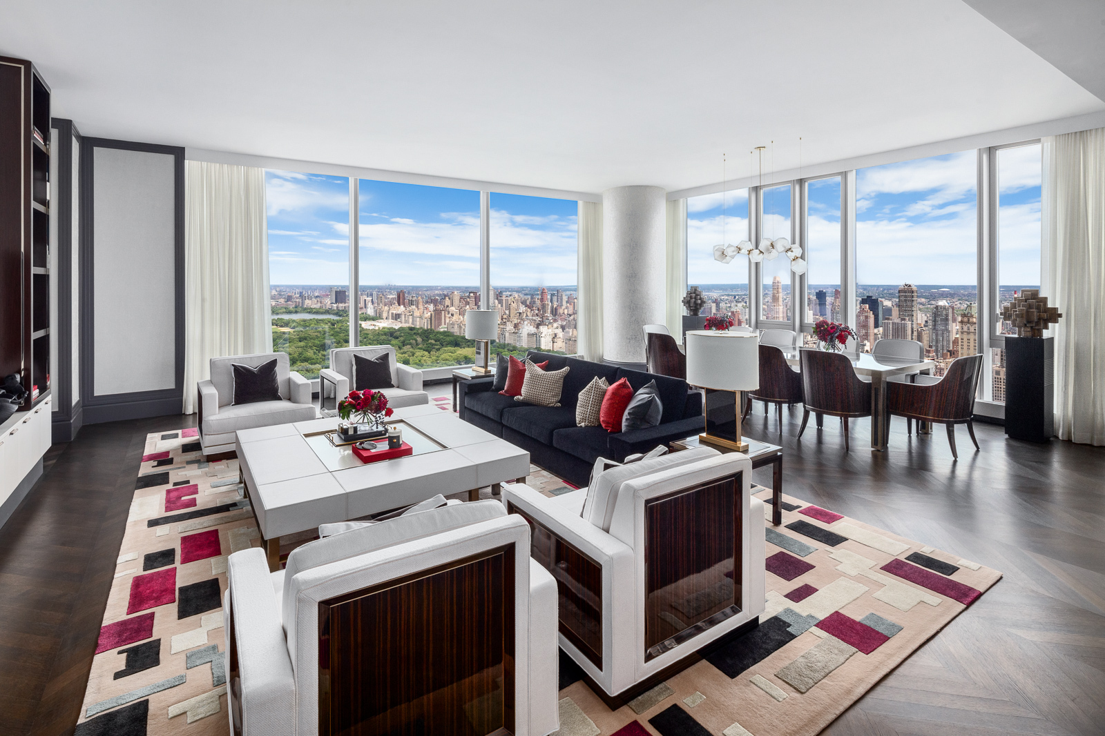 a living room with furniture and a floor to ceiling window