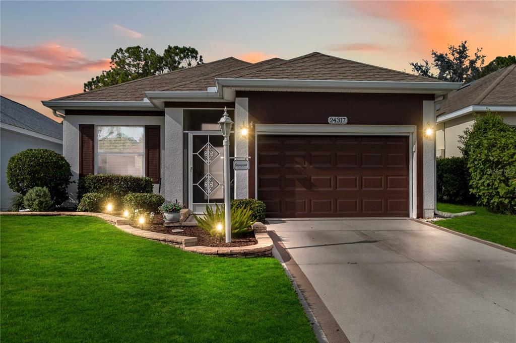 a front view of a house with a yard