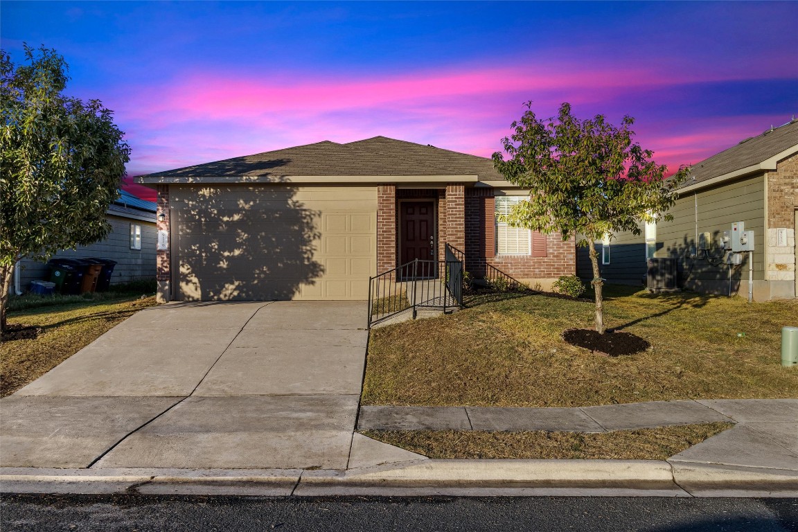 a front view of a house with a yard