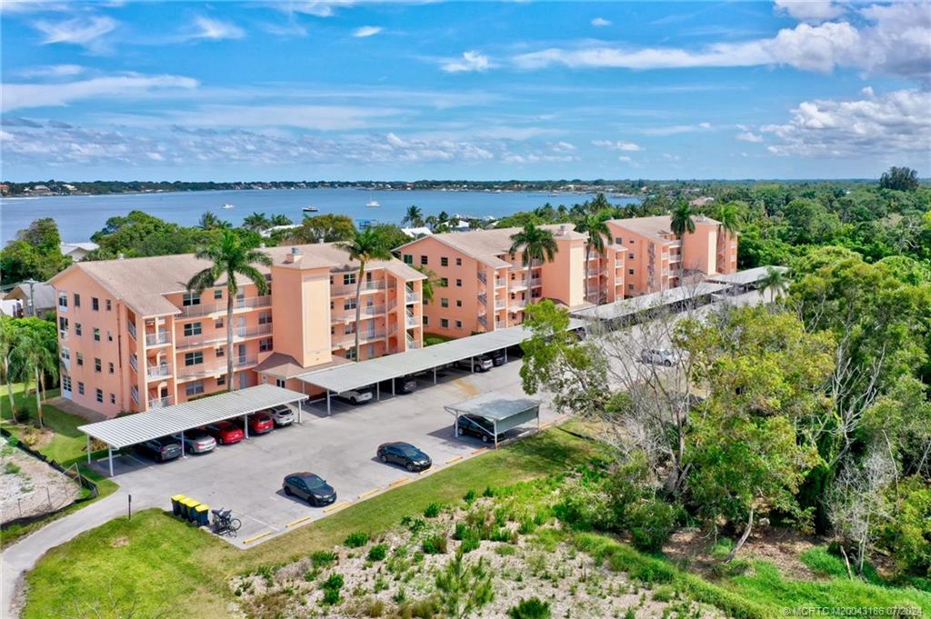 an aerial view of multiple houses with yard