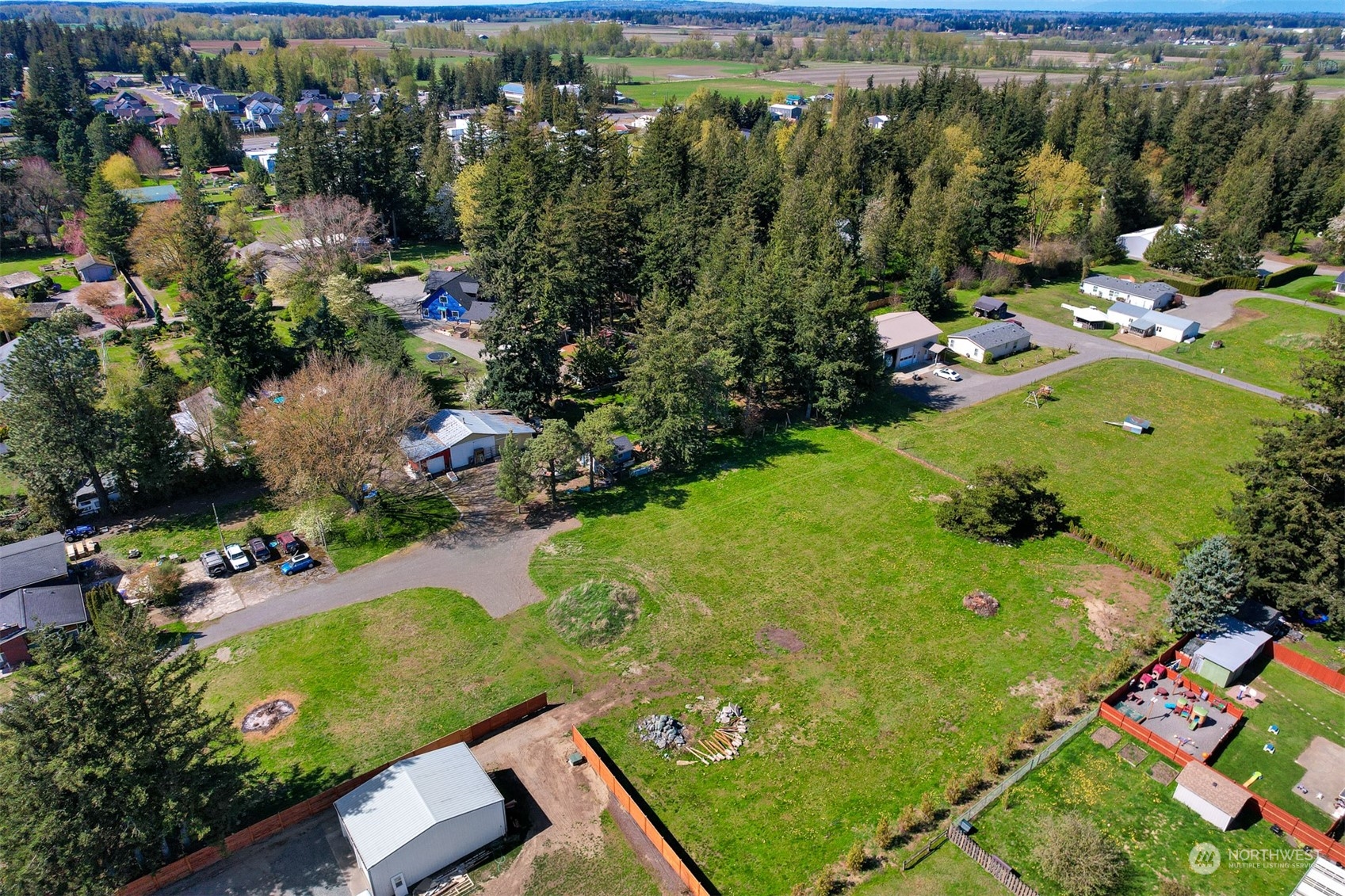 an aerial view of a residential houses with outdoor space