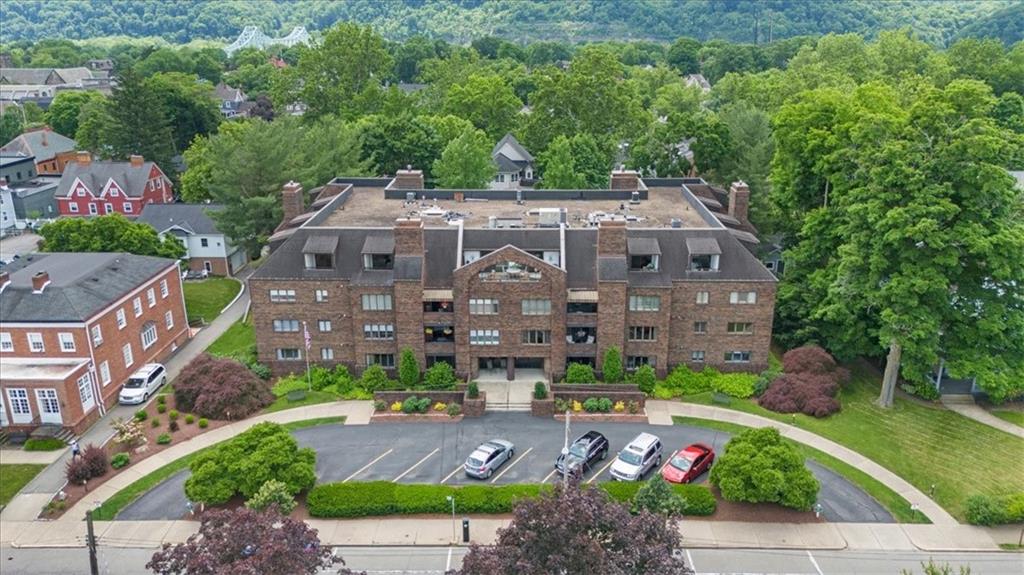 a aerial view of a house with garden space and a street view