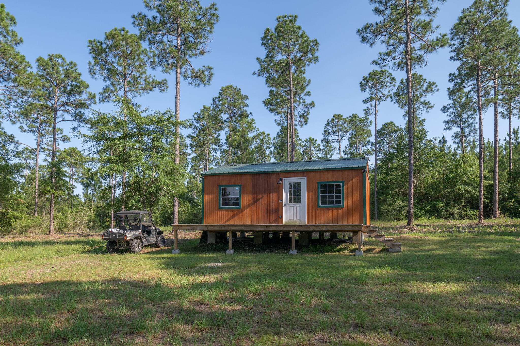 a front view of house with yard and trees