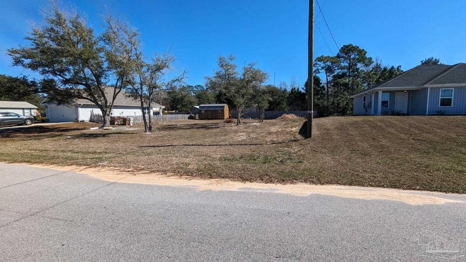 a view of a house with a backyard of the house