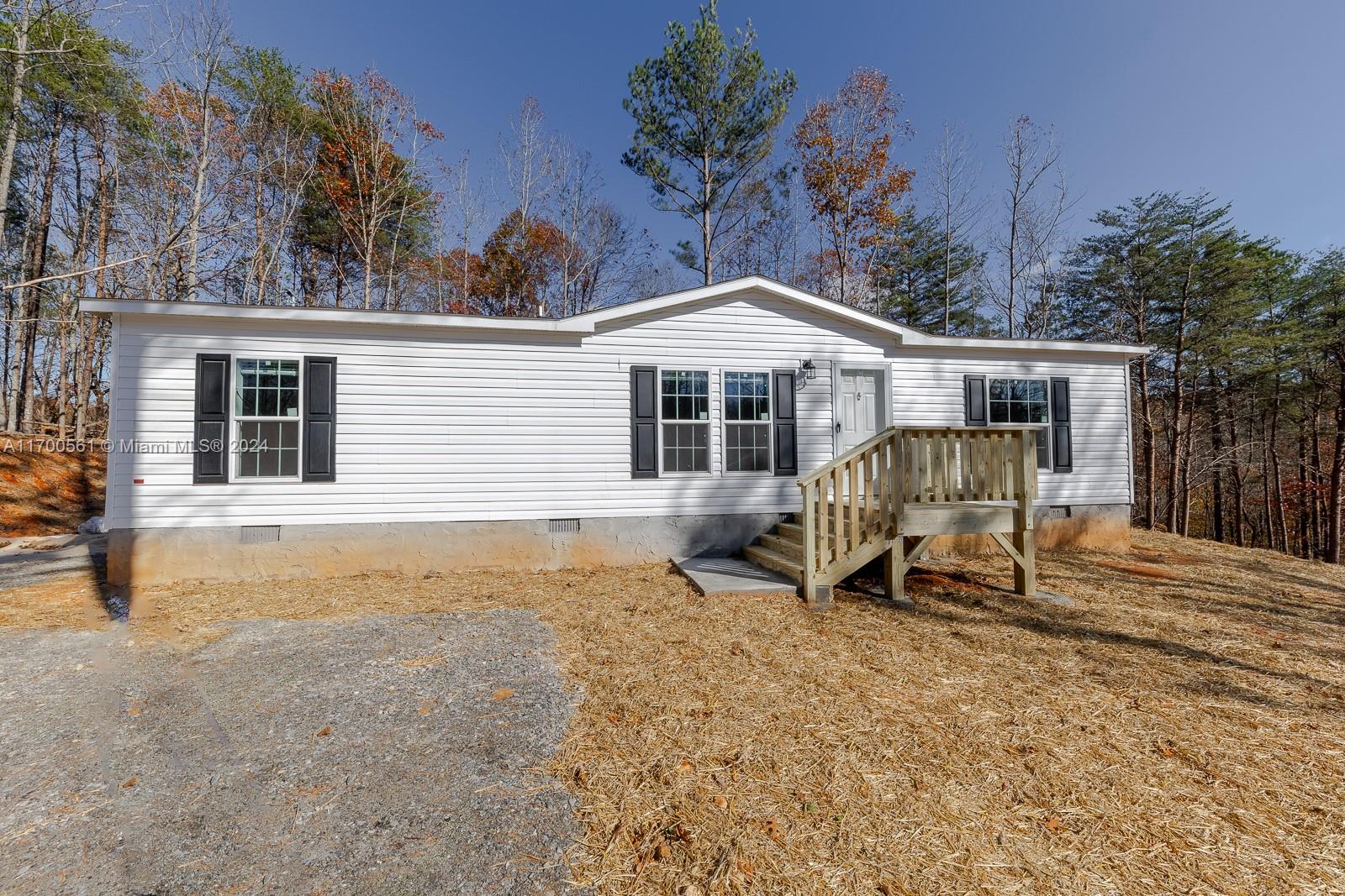 a view of a house with backyard porch and sitting area