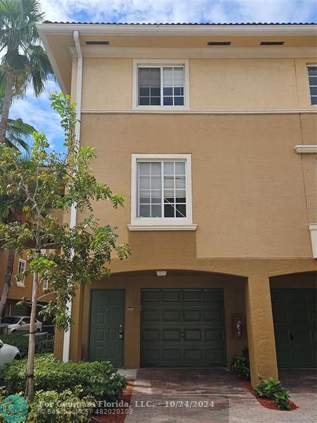 a front view of a house with garage