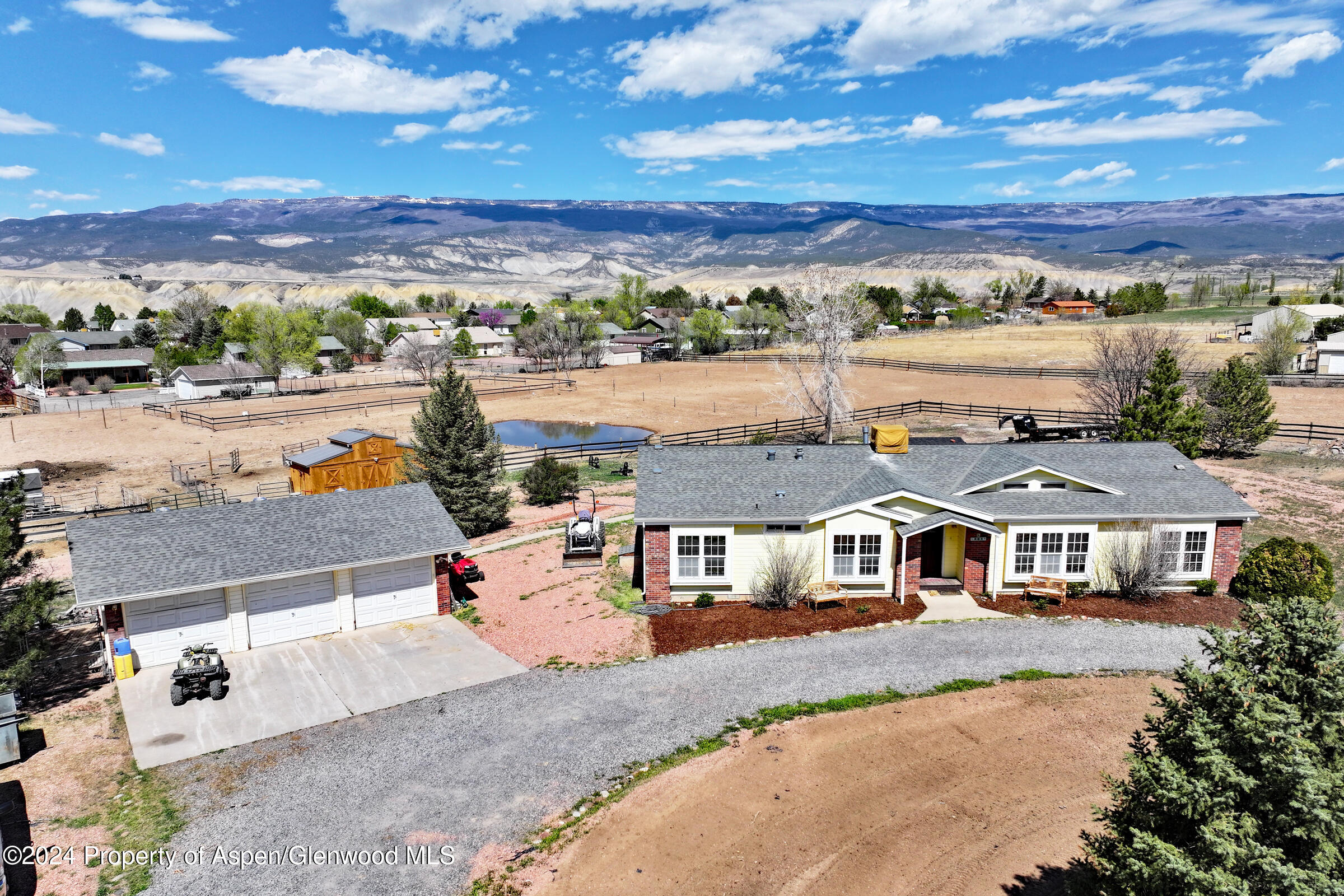 an aerial view of a house with a city view