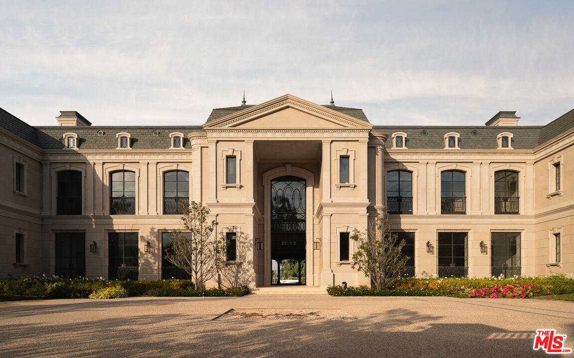 a view of a big building next to a road