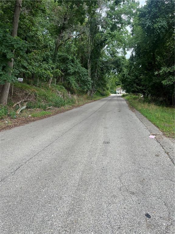 a view of a road with a trees