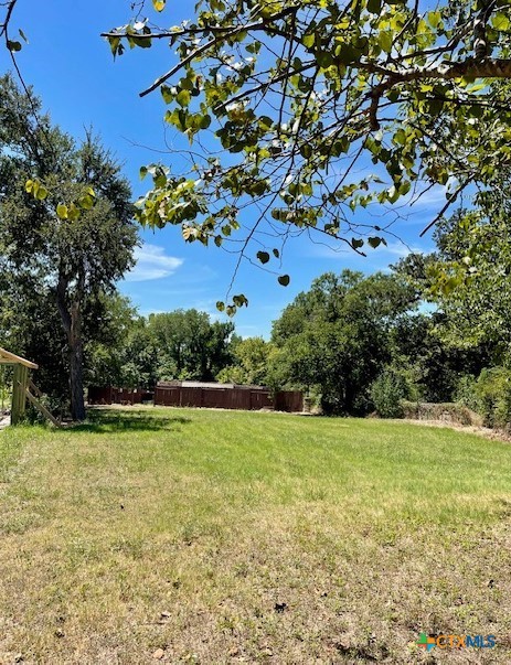 a view of a field with an trees