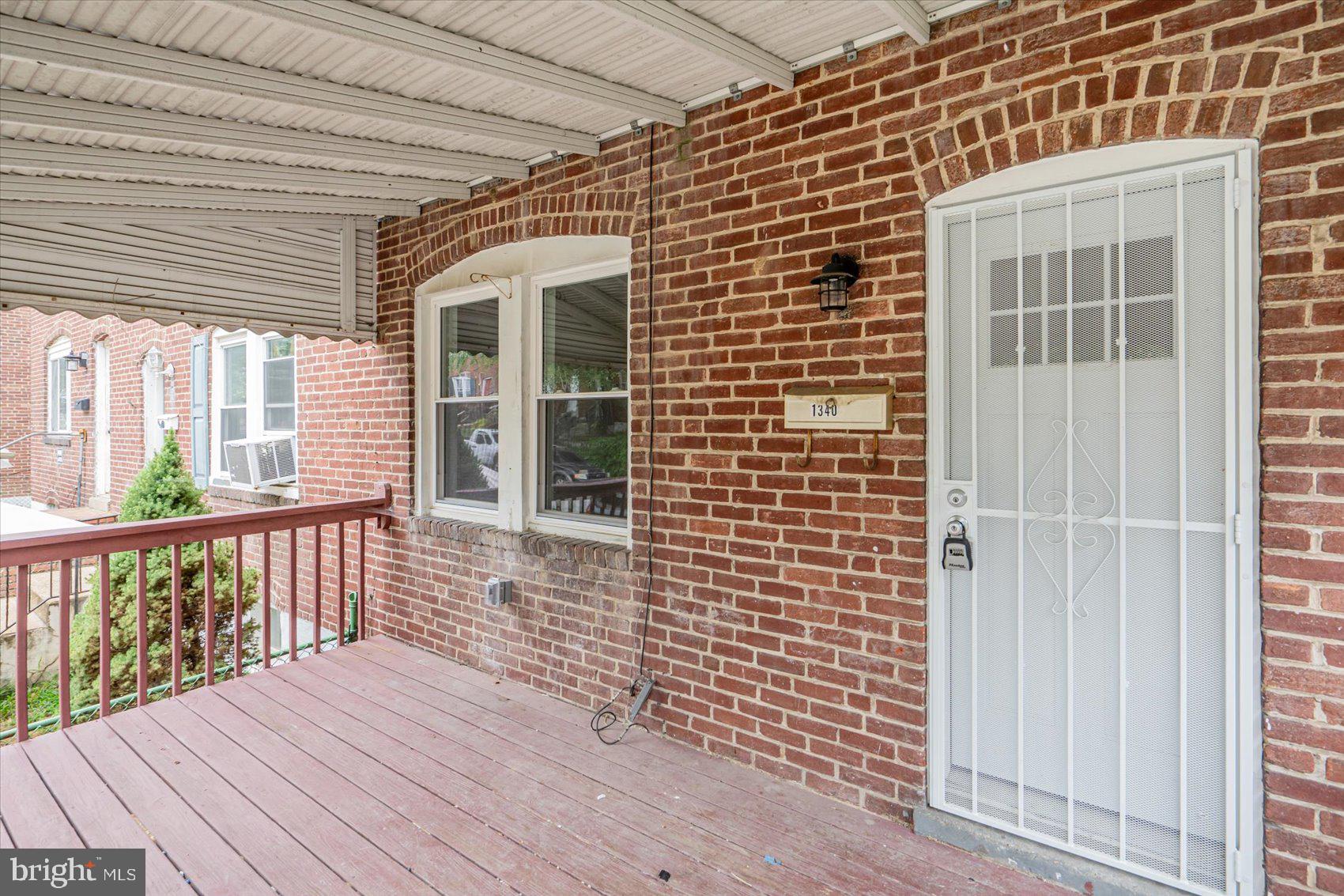 a view of a balcony with wooden floor