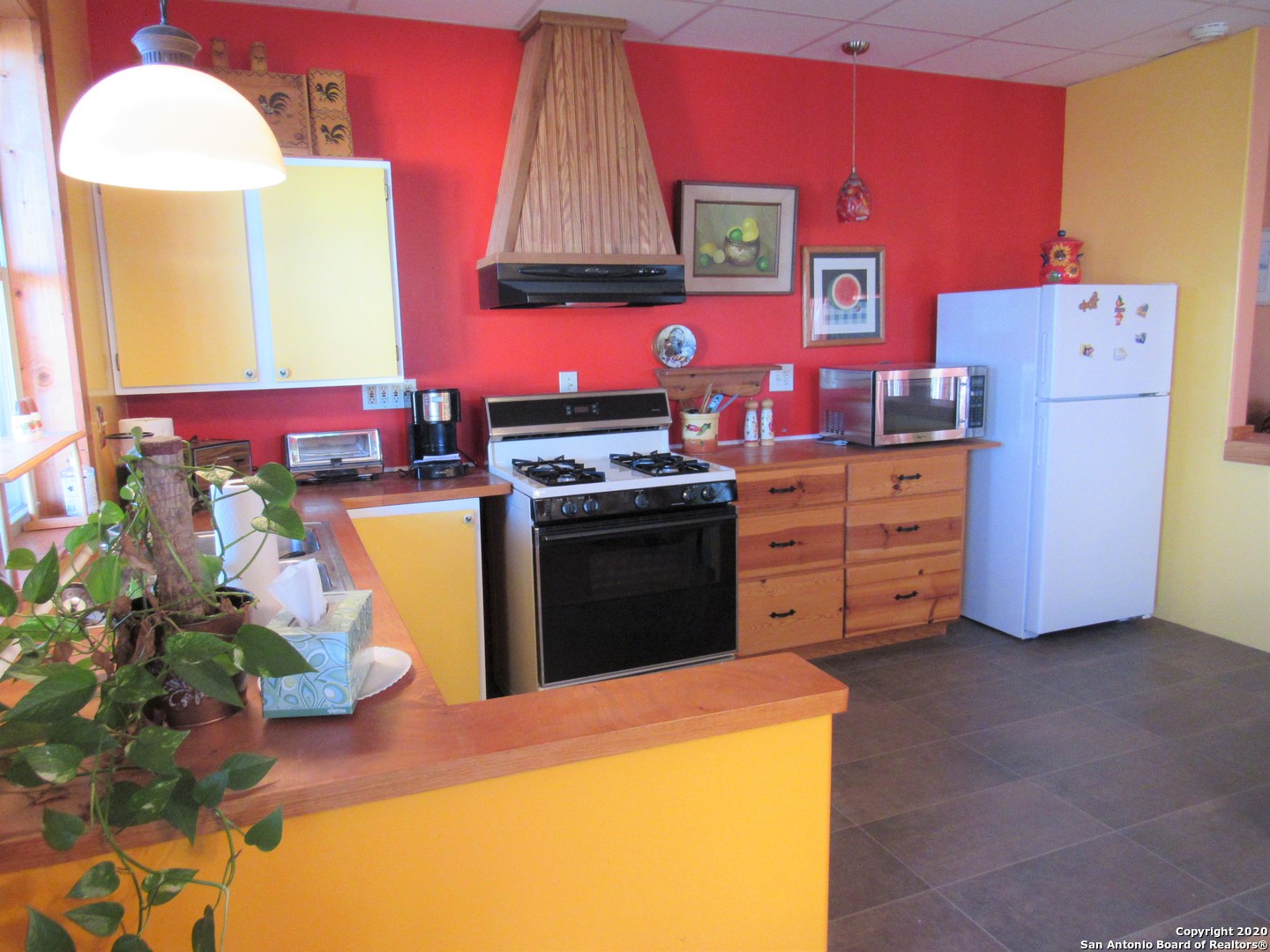 a kitchen with cabinets a sink and a stove