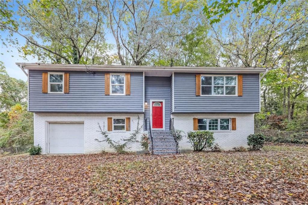 front view of a house with a trees