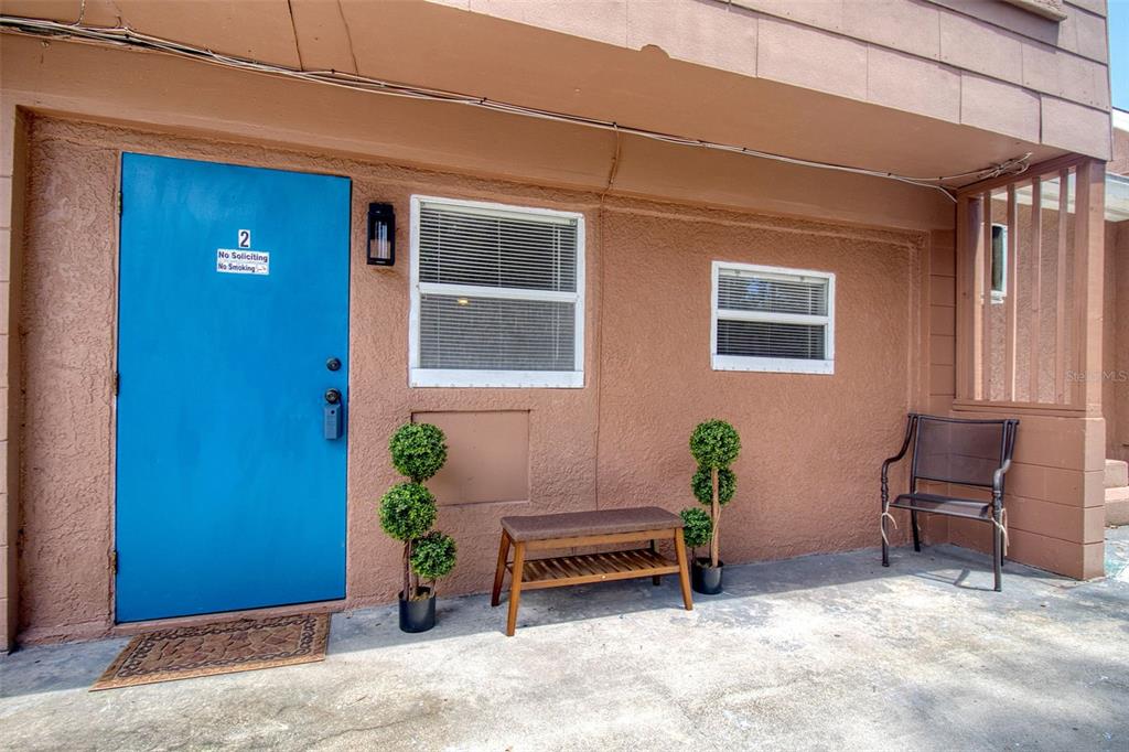 a view of a lounge chair in front of a house