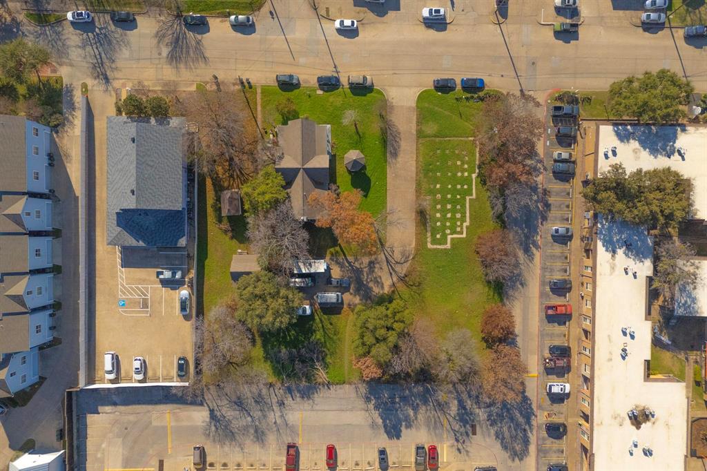 an aerial view of a residential apartment building with swimming pool