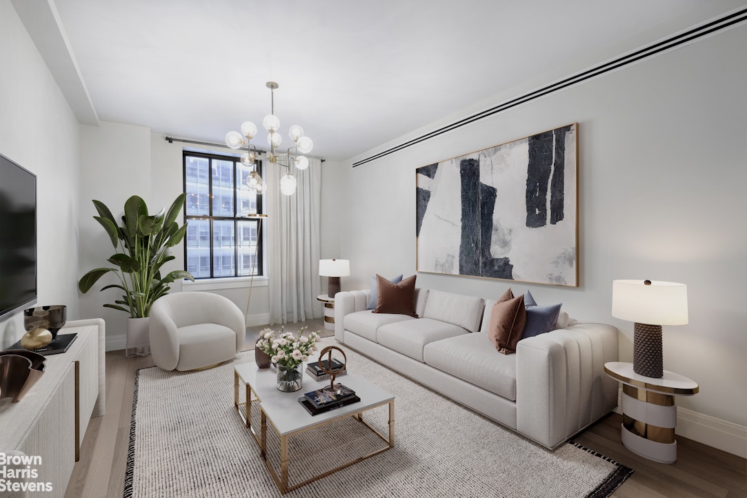 a living room with furniture potted plant and a chandelier