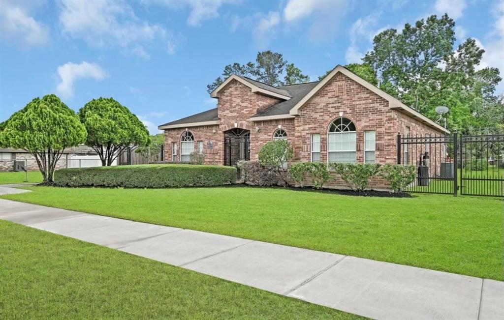 a front view of house with yard and green space