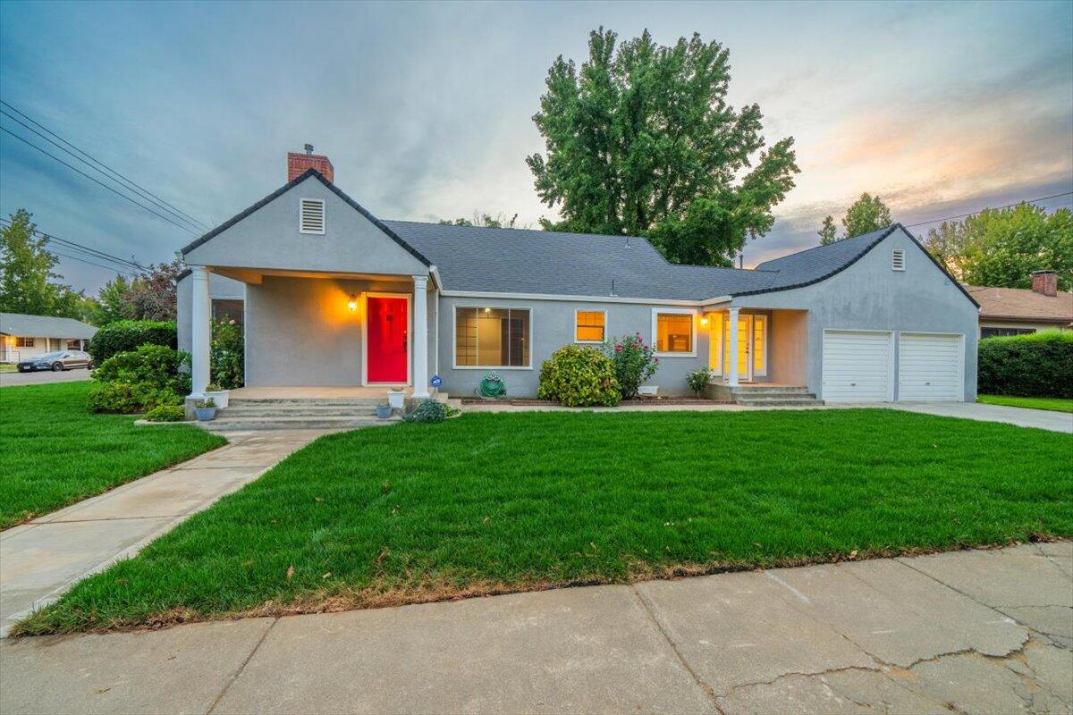 a front view of a house with yard