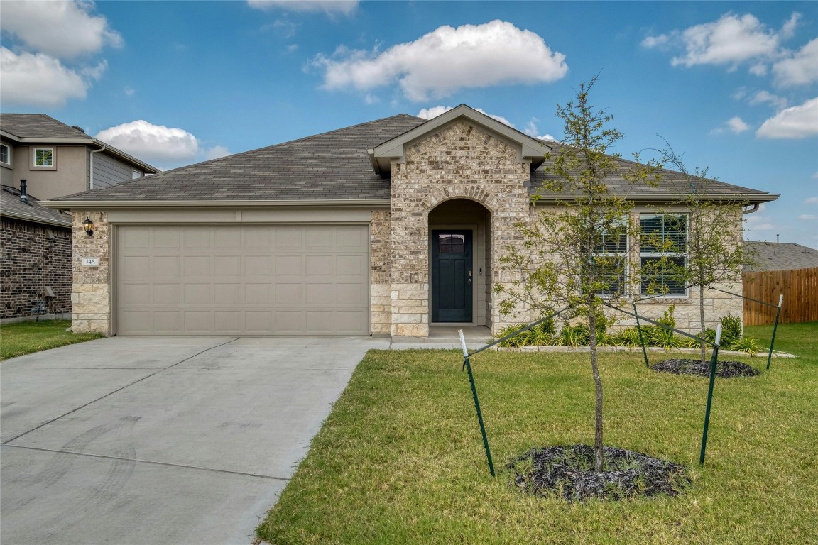 a front view of a house with a yard