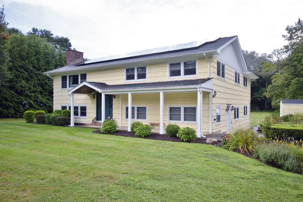 a front view of a house with a yard