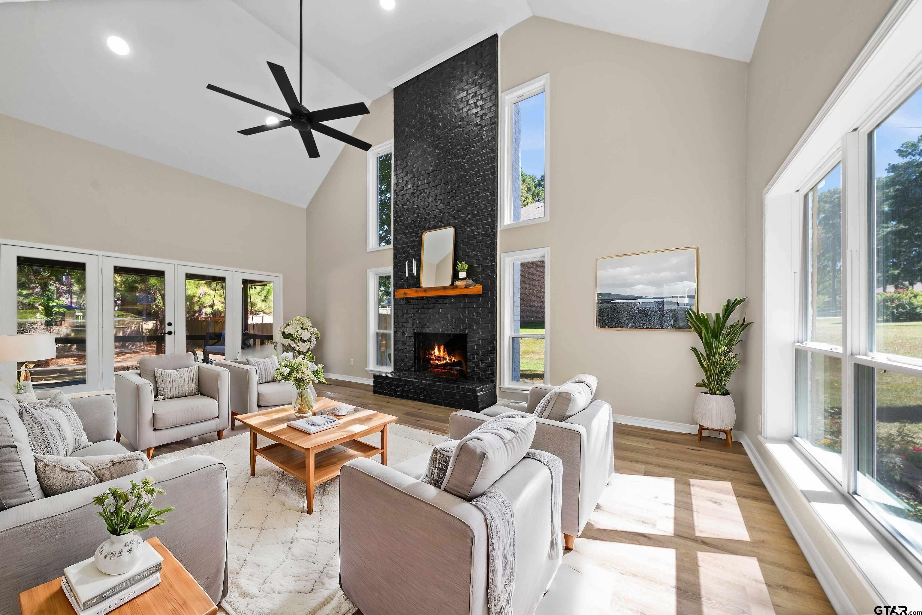 a living room with furniture and a fireplace