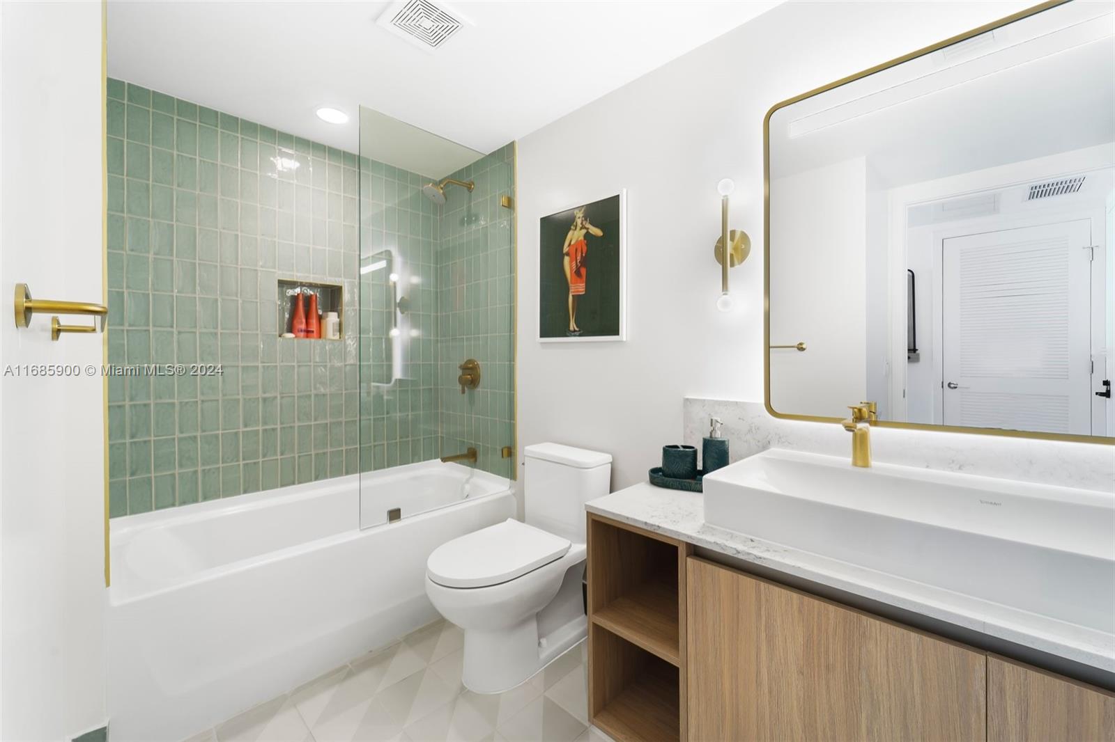 a bathroom with a bathtub shower sink mirror and toilet