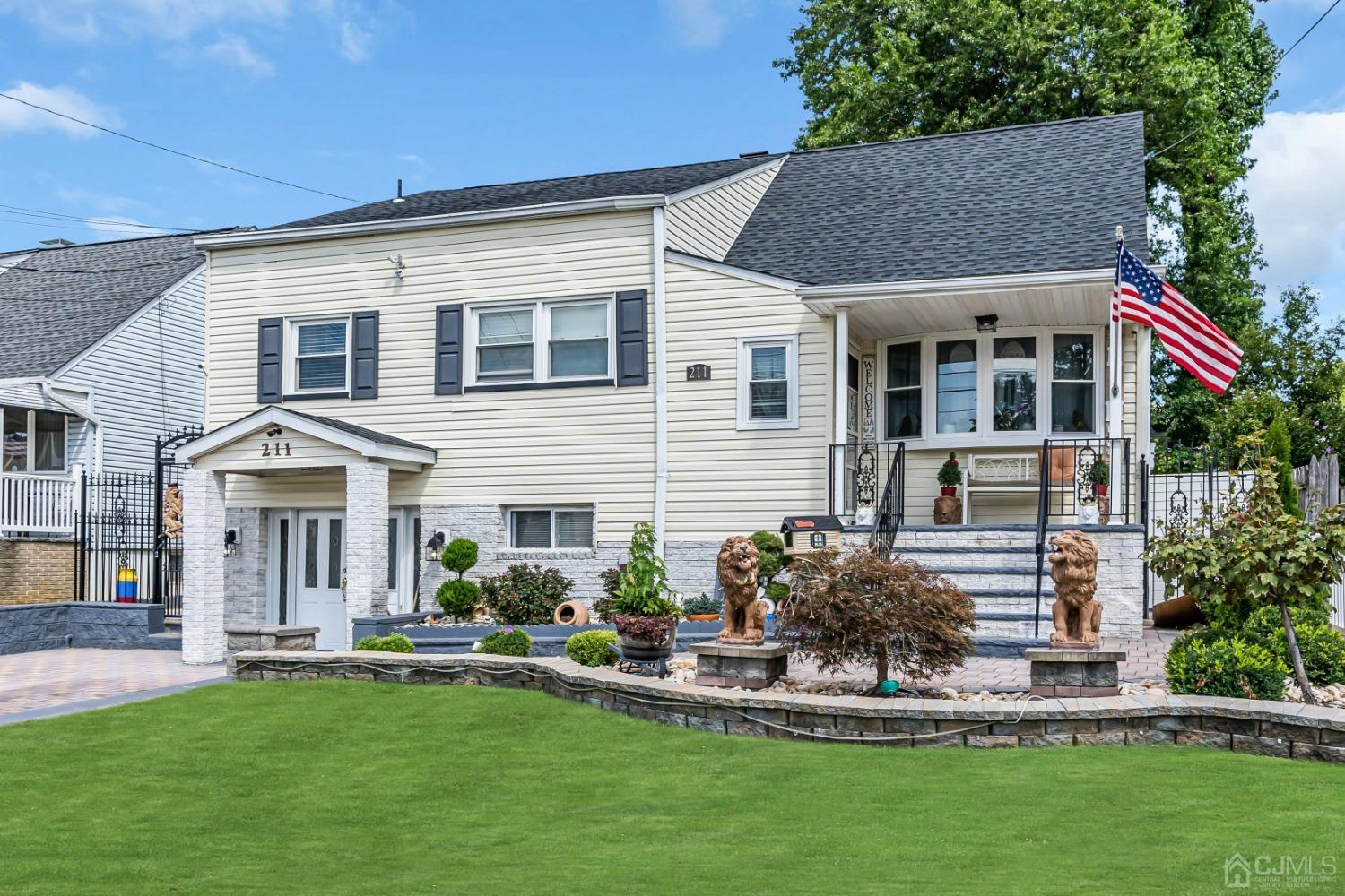 a front view of house with a garden and patio