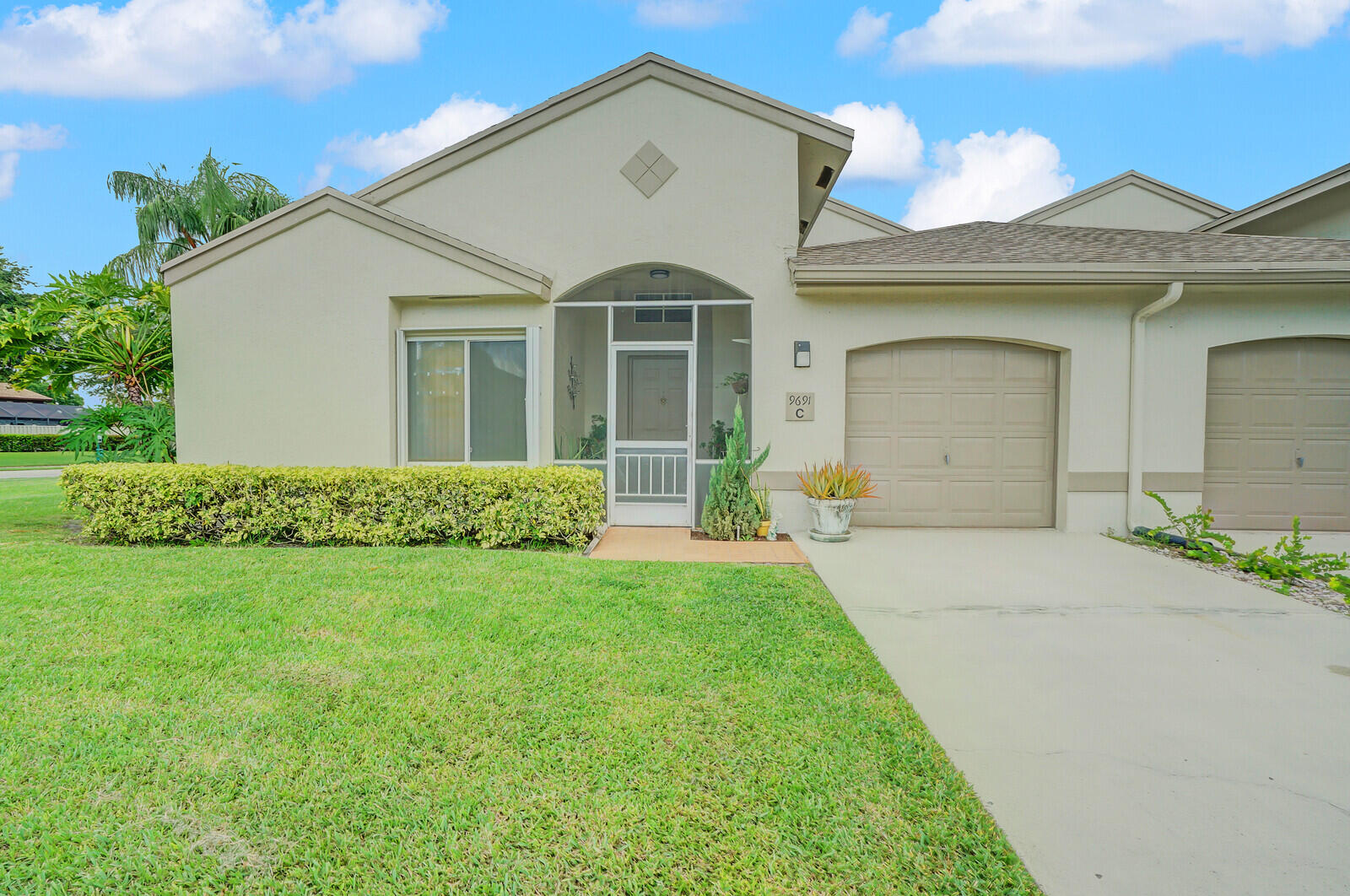 front view of a house with a yard