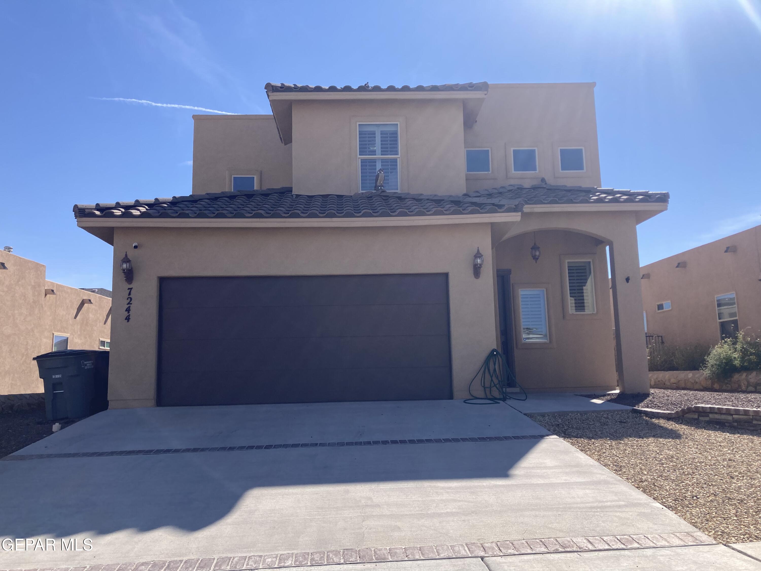 a front view of a house with yard