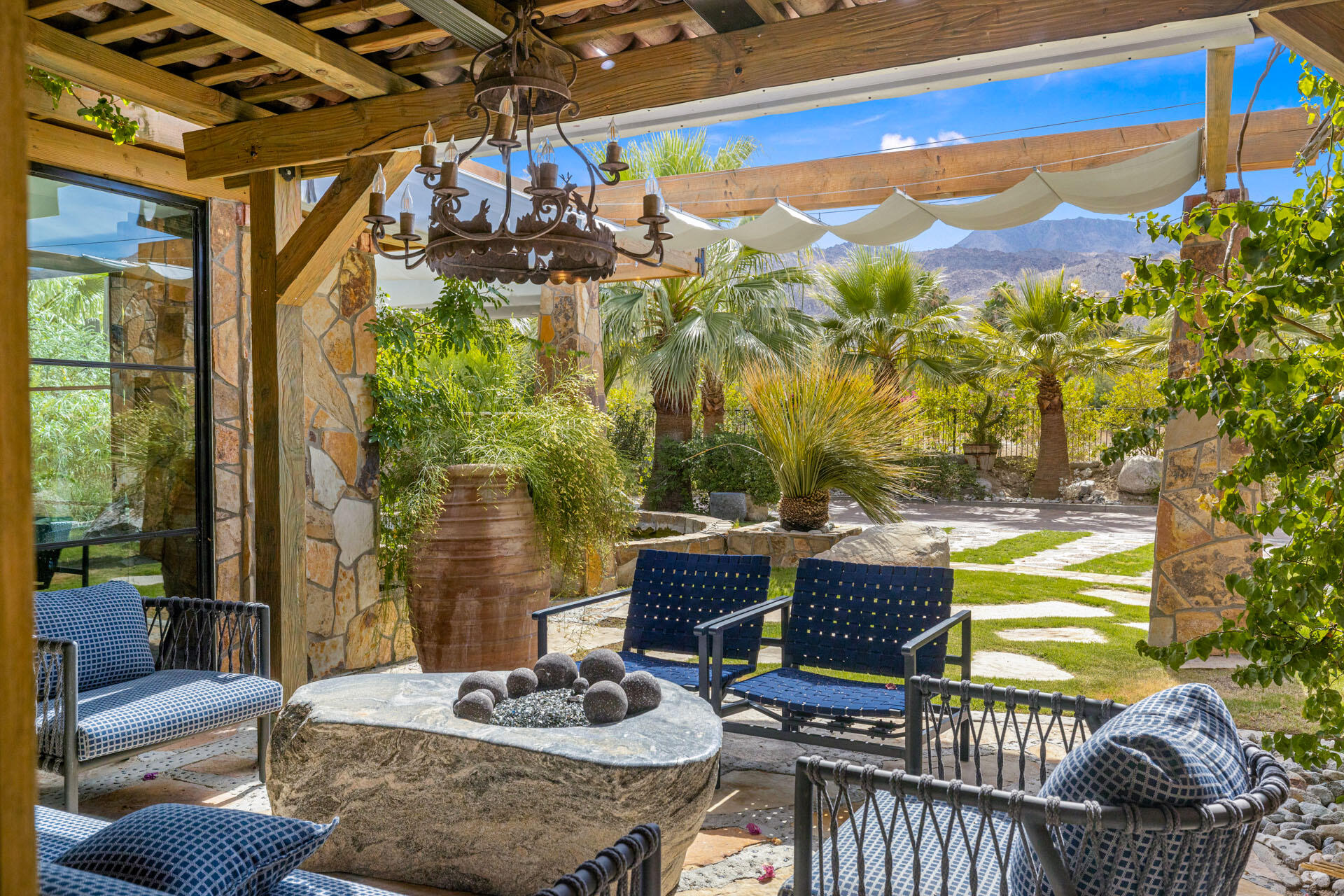 a outdoor living space with furniture and a potted plant