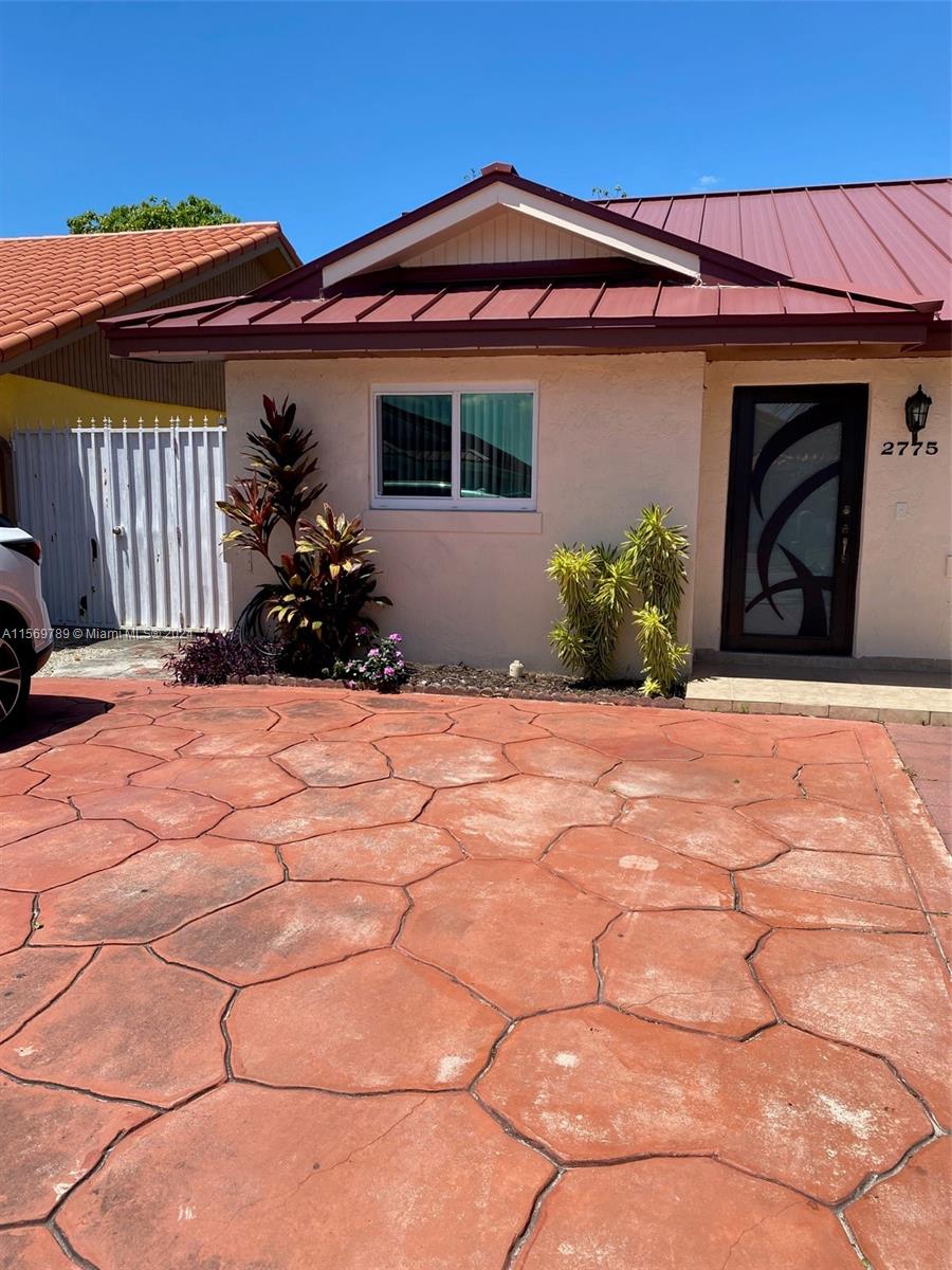 a view of a house with a patio