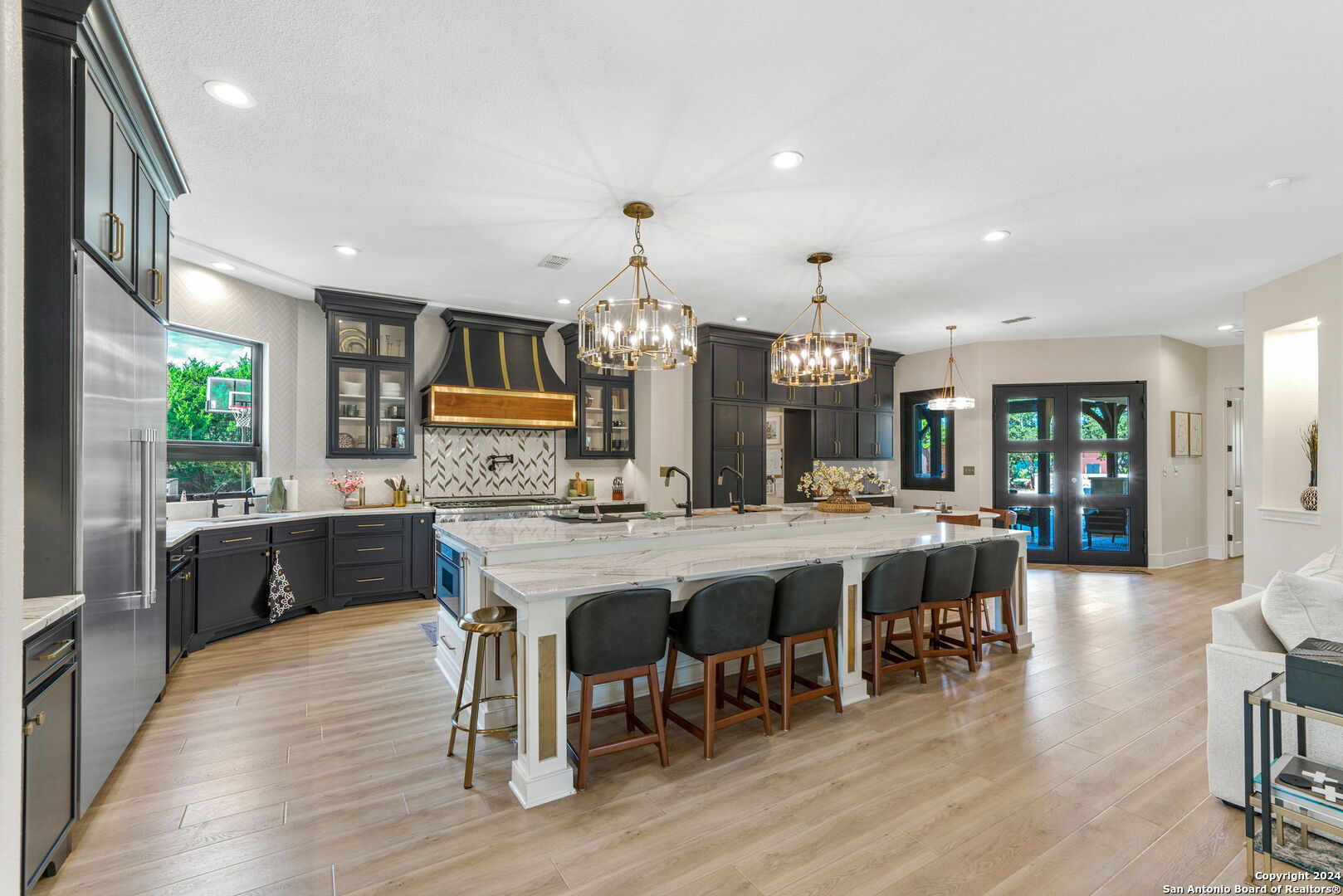 a large kitchen with a table and chairs