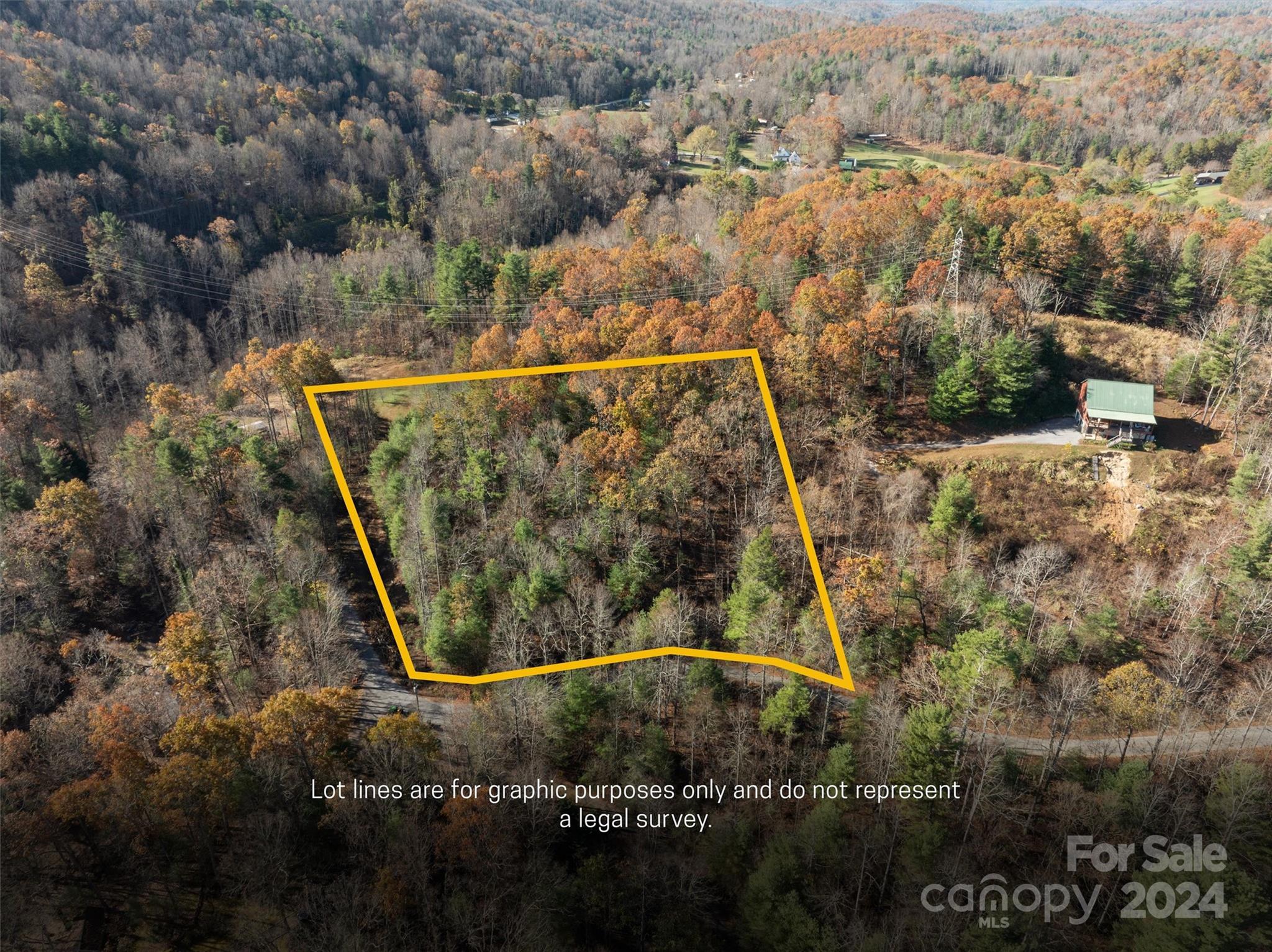 an aerial view of a houses with a yard