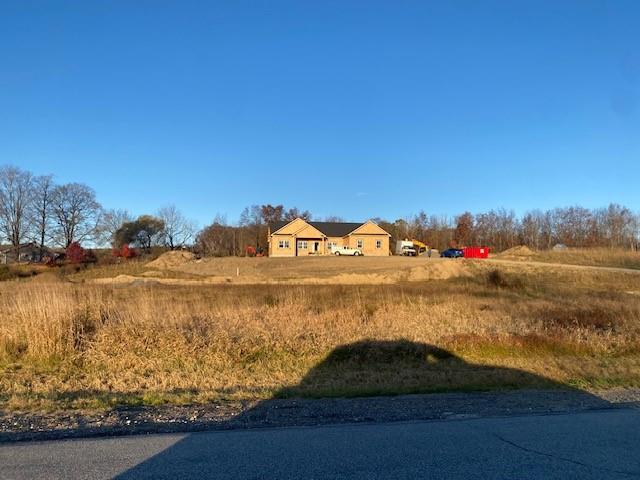 View of front facade featuring a garage