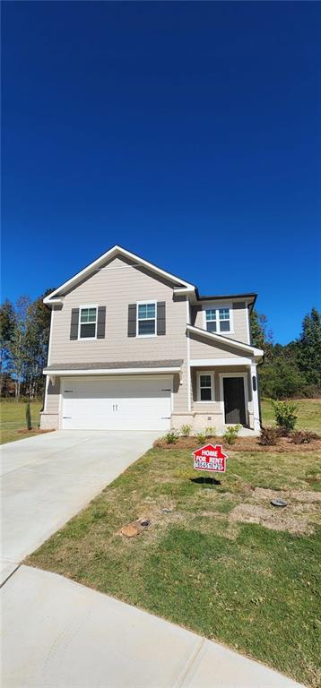 a front view of house with yard and seating area