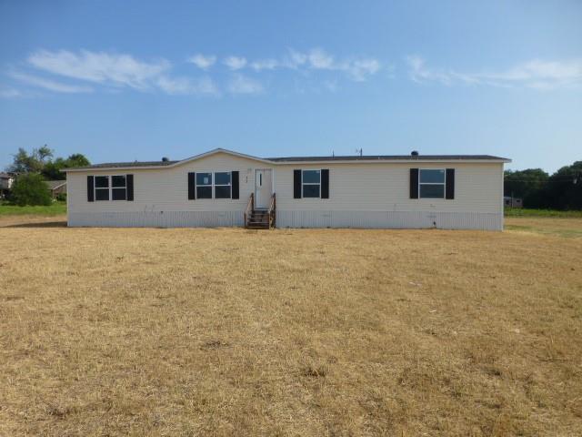 a view of house with yard